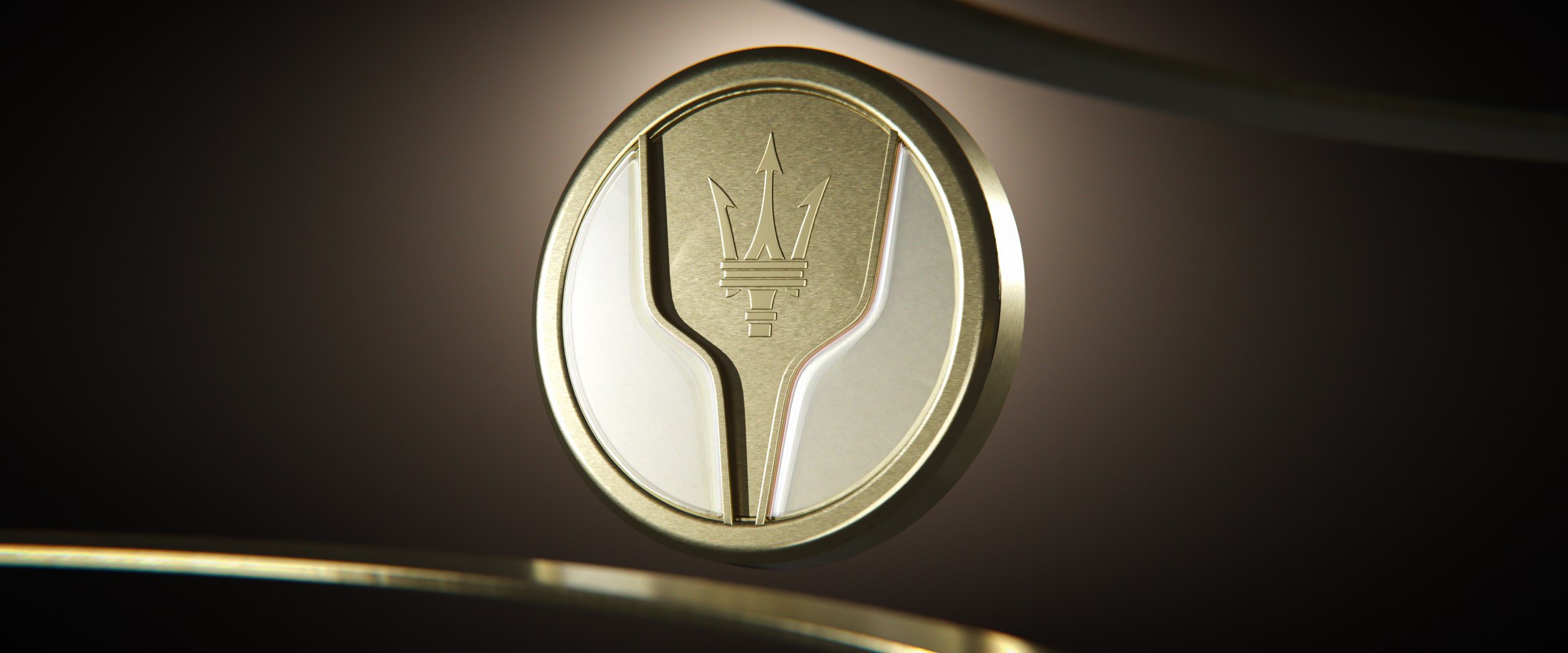 Il Sigillo — brass disc with Maserati trident, hero product shot